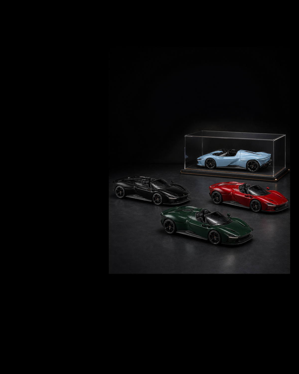 Four red, pale-blue, green and black Daytona SP3 collectibles in one charcoal miniature collector gallery.