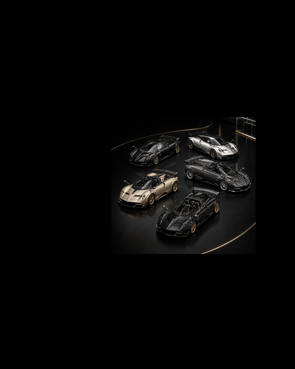 Five black, silver, champagne and graphite Pagani Huayra BC collectibles in a continuous carbon-fibre miniature atelier.