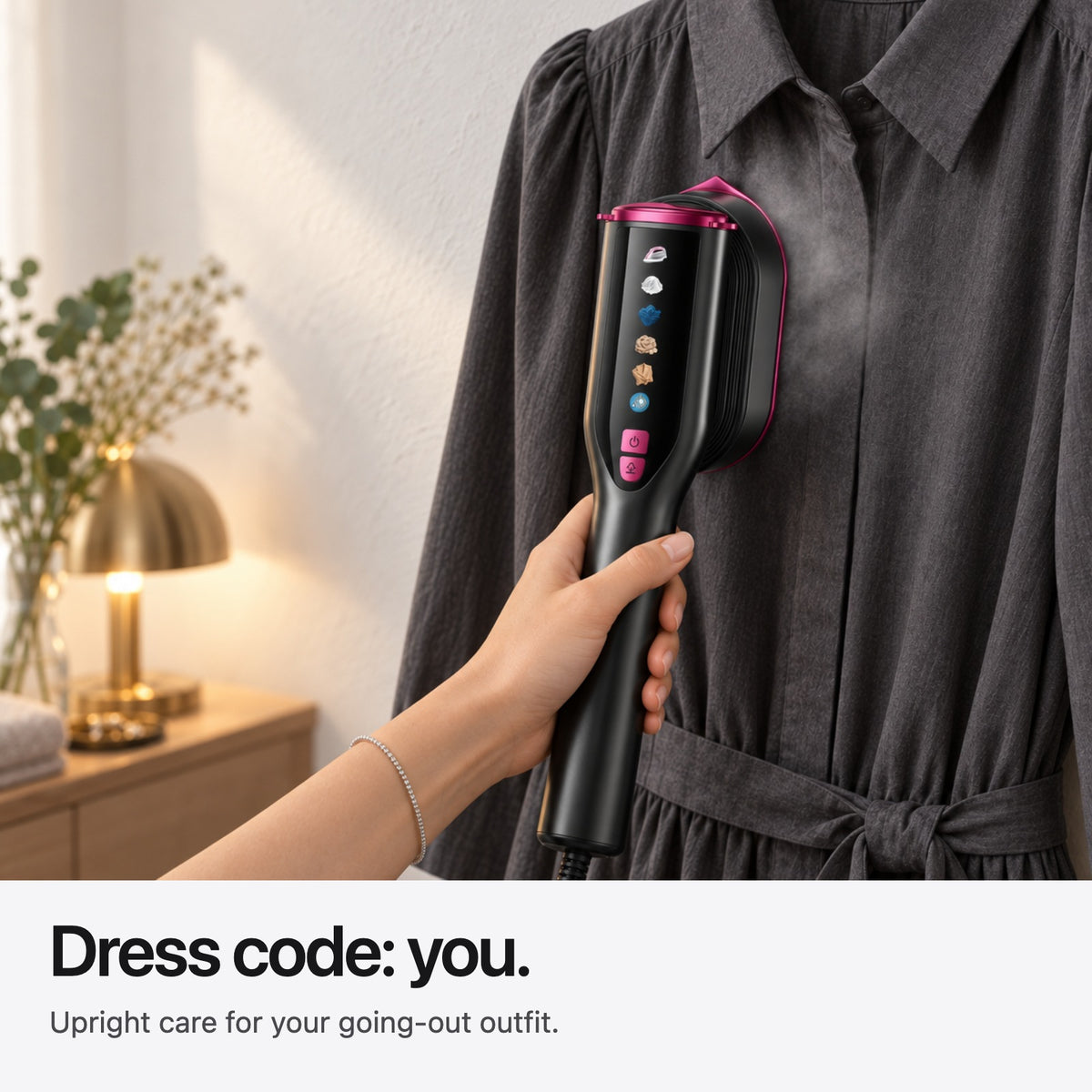 Carter & Cole upright steaming a hanging charcoal dress before an evening out