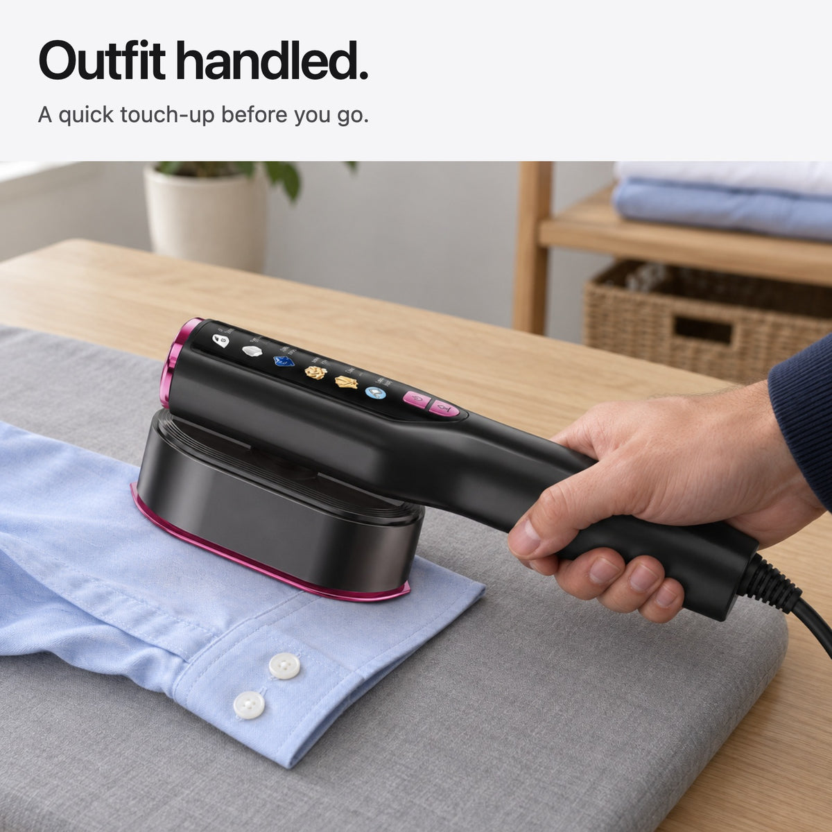 Carter & Cole flat pressing a pale blue shirt cuff on a padded ironing surface