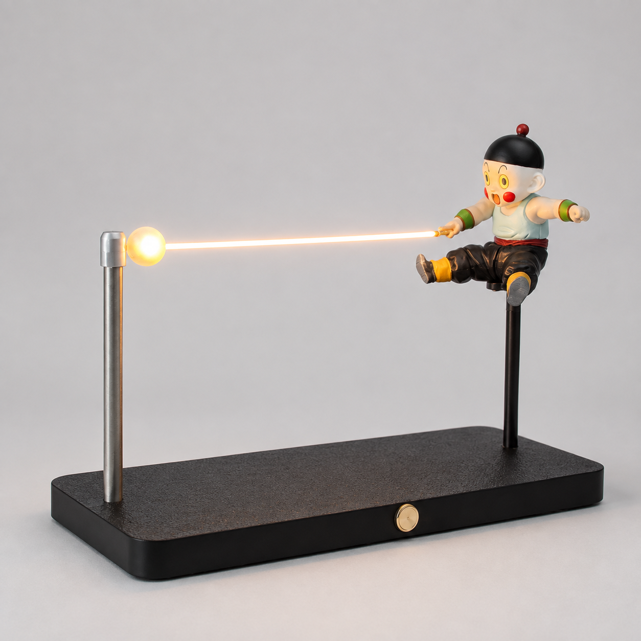 Chiaotzu amber energy lamp with black display base and two visible support posts.