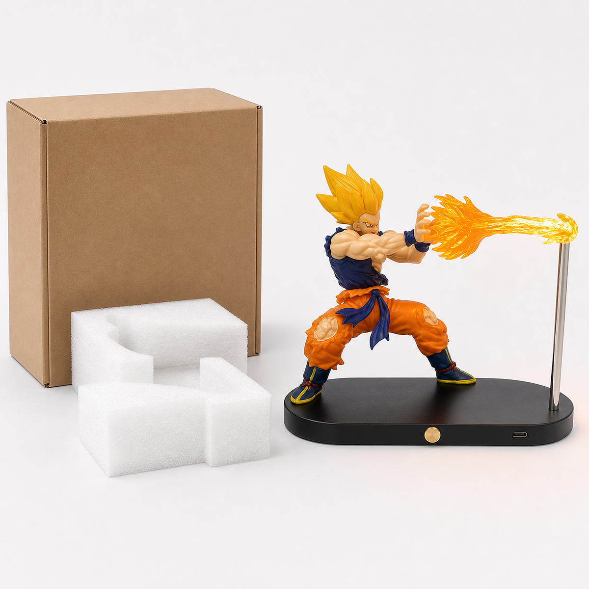 Super Saiyan Goku orange-energy display lamp with its plain carton and protective foam.
