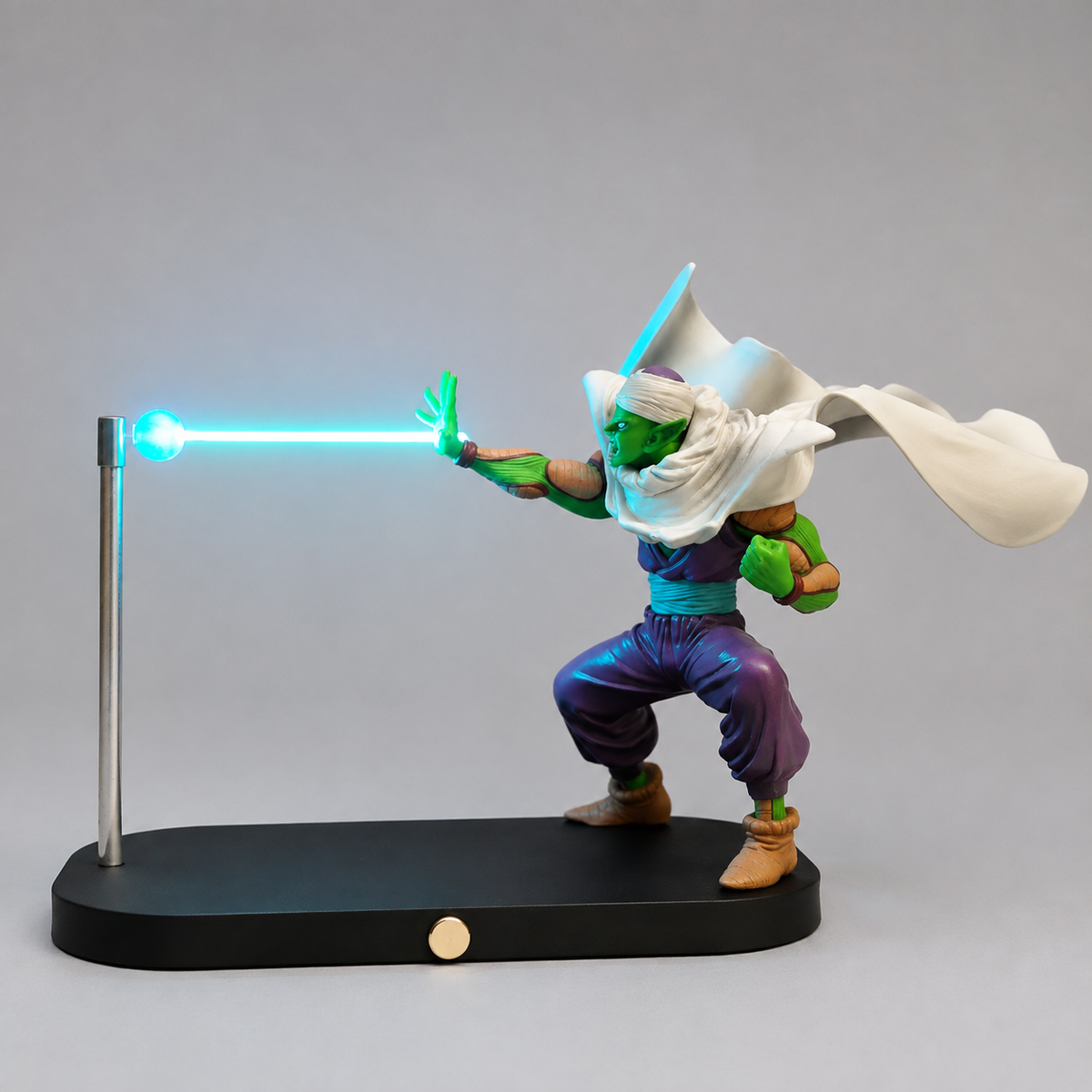Piccolo blue energy lamp with white cape, display base and visible support post.