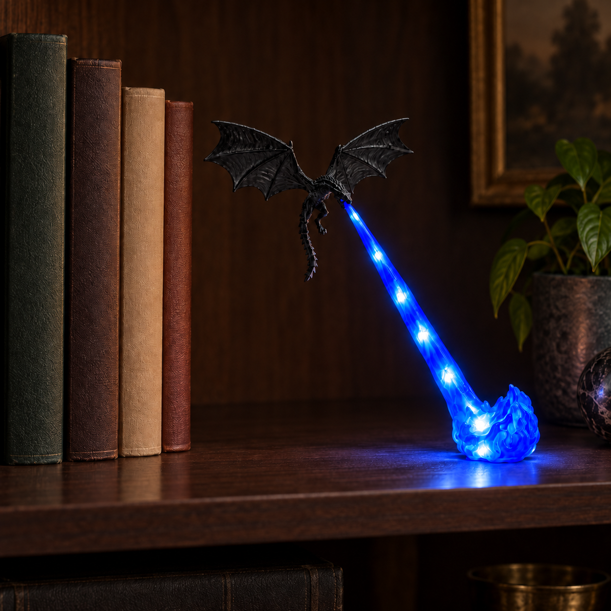 Small Blue Flame Dragonfire lamp, displayed on a bookshelf, with bright LED points in the translucent flame beam and foot.