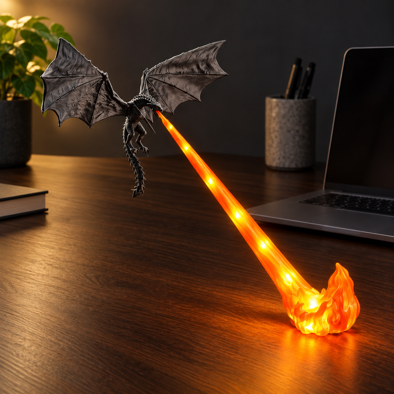 XL Orange Flame Dragonfire lamp, displayed on a dark desk, with bright LED points in the translucent flame beam and foot.