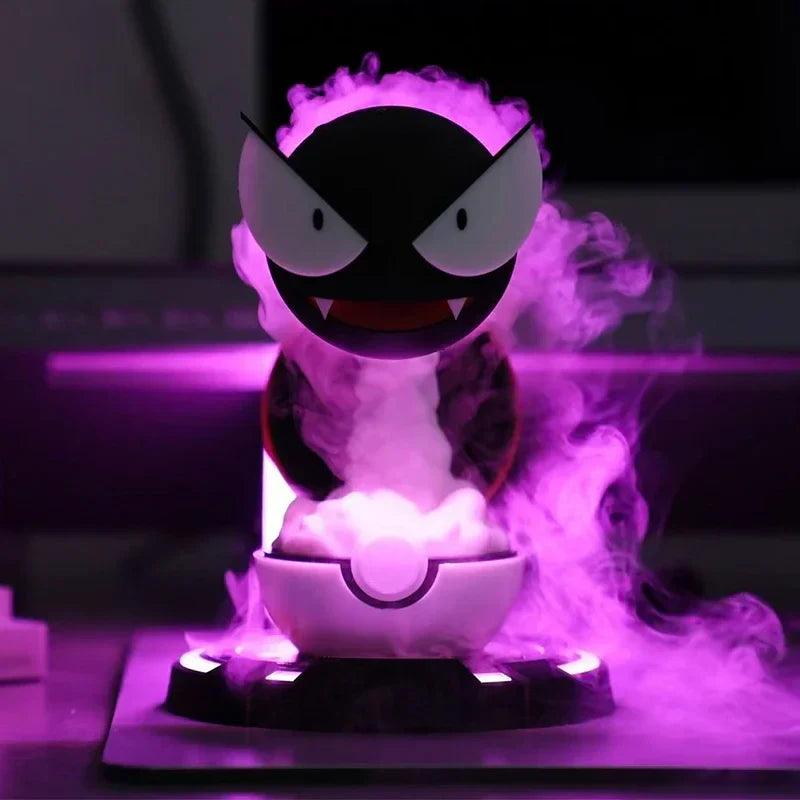 Gastly humidifier photographed with purple-lit mist, white bowl and black display base