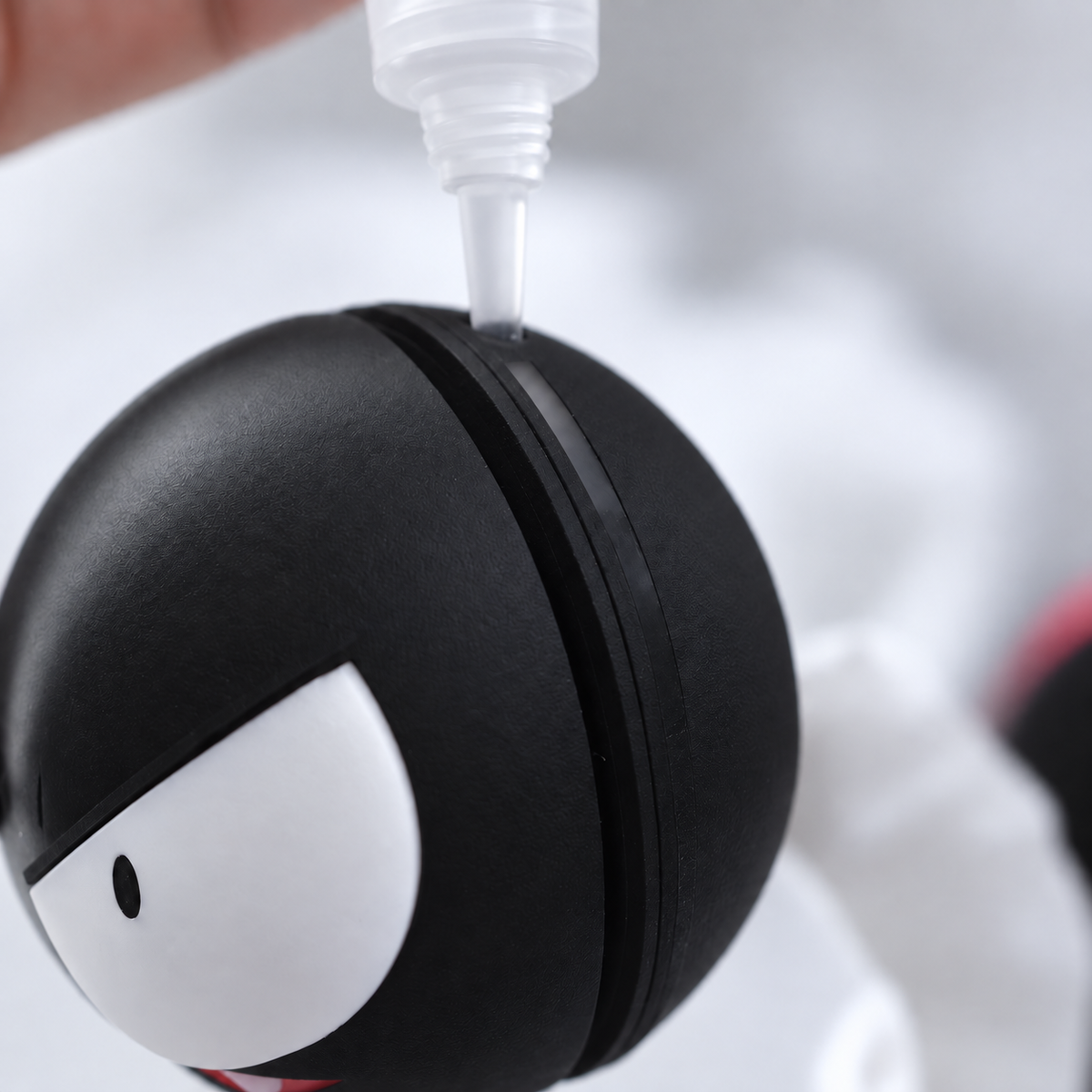 Close-up of the Gastly water reservoir being filled through the opening on top of the head